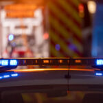 Blue and red police flashing light at night time. Mid shot